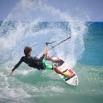 Person Riding Surf Board